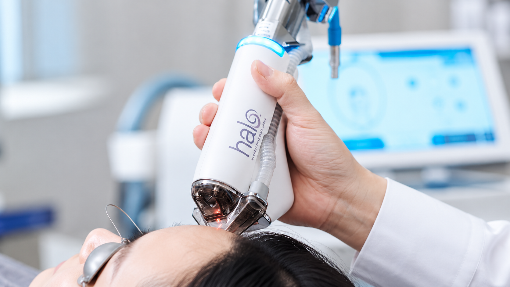Dermatologist using Sciton Halo hybrid fractional laser handpiece for patient facial skin resurfacing treatment in Busan.