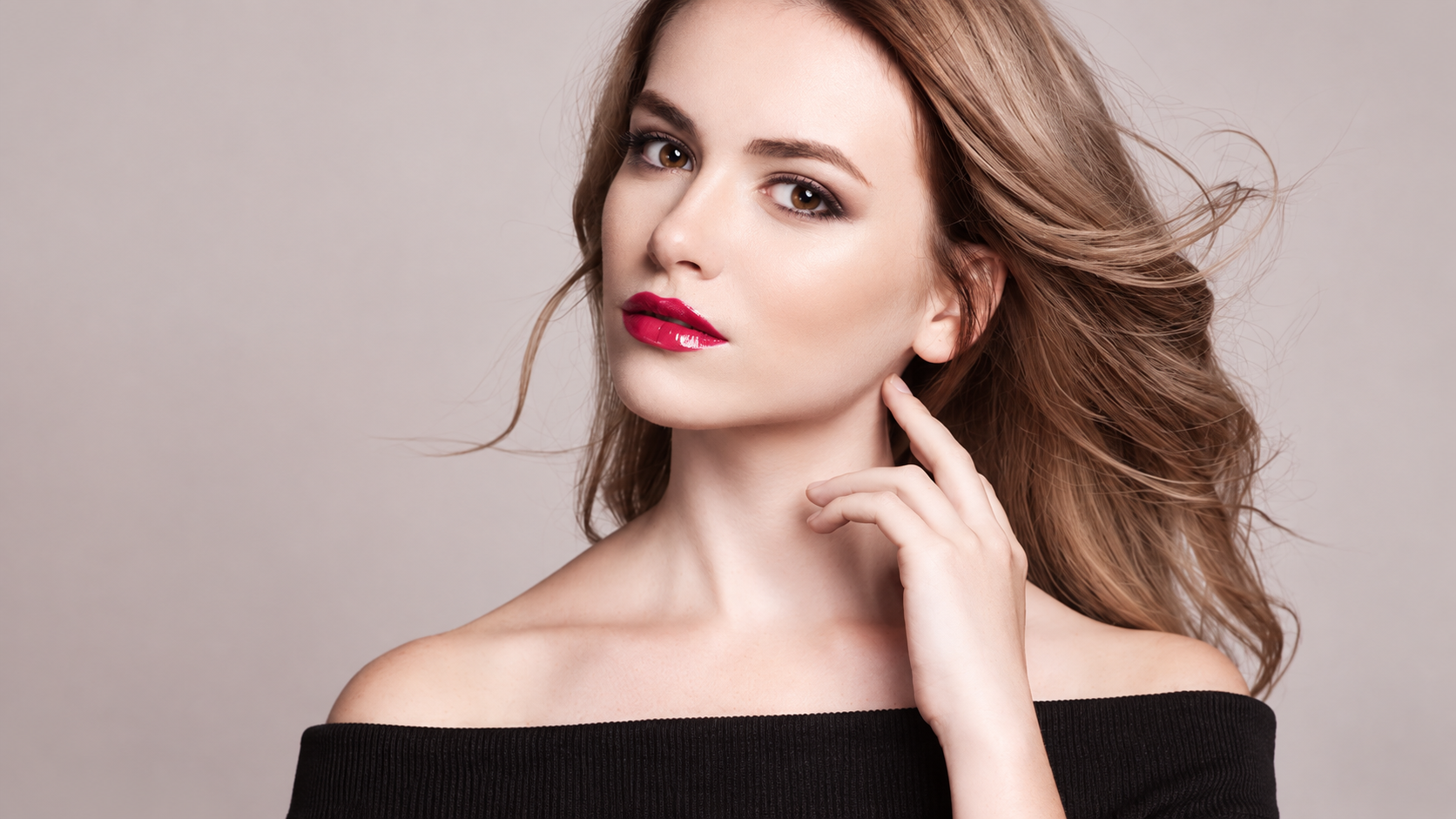 Beautiful woman posing naturally to showcase youthful facial contouring and anti-aging aesthetic results.