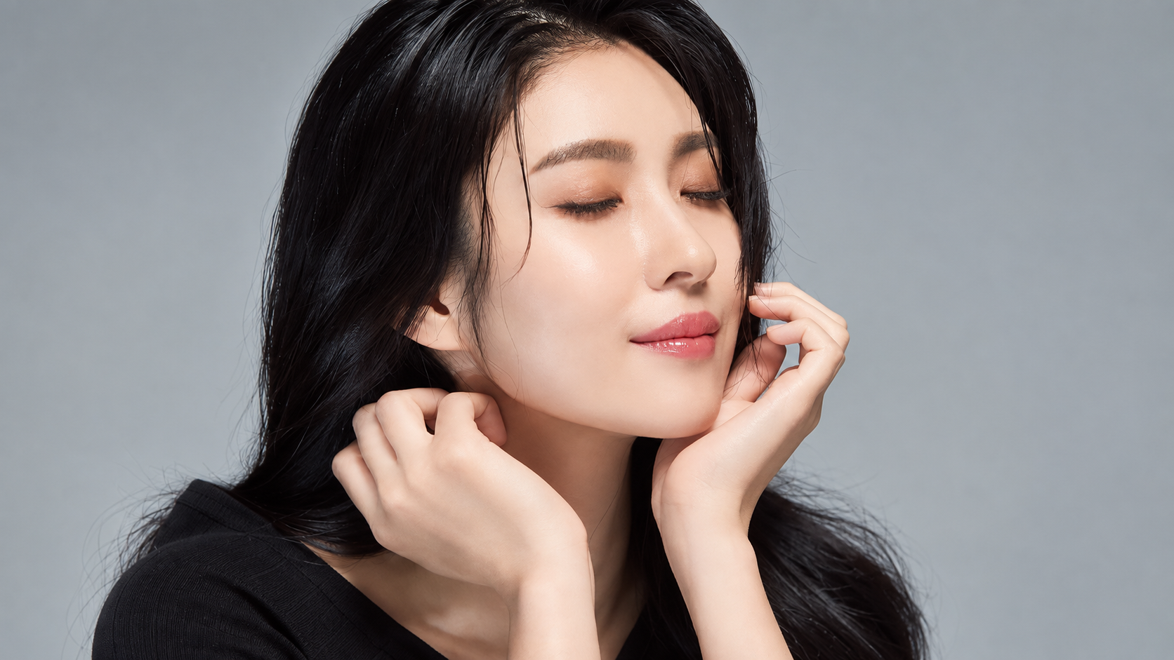 Young woman displaying smooth facial skin and contoured jawline after cosmetic botox treatment.