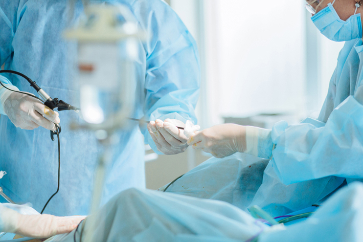 Medical team performing uterine condition treatment during a clinical procedure