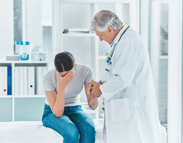 Doctor providing compassionate support to patient during miscarriage management treatment process