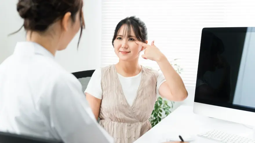 Patient undergoing her eye during a medical consultation.