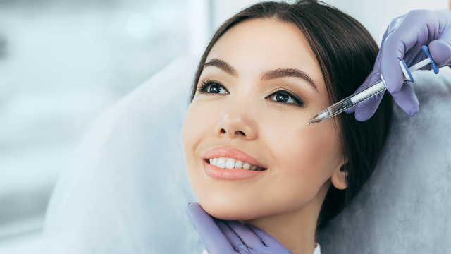 Patient receiving a stem cell treatment on the face.