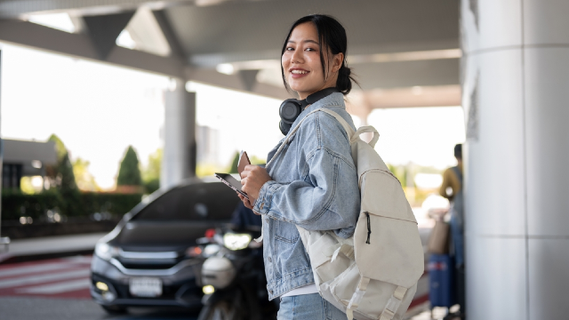 Traveler arriving at the airport, as the return trip home often brings tougher jet lag than the outbound flight