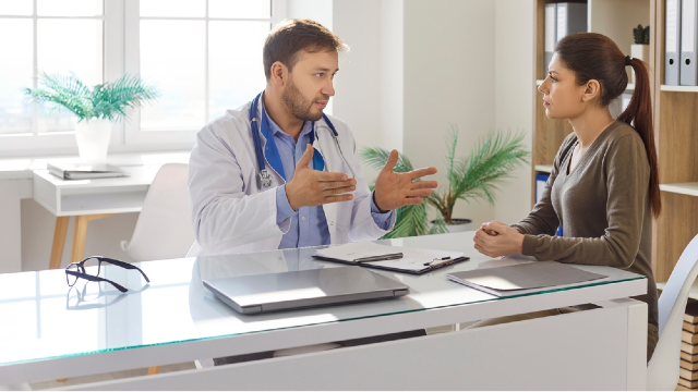 Doctor and patient discussing personalized treatment plan during medical consultation