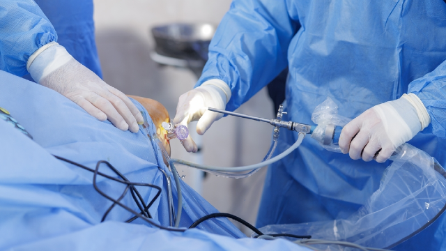 Surgeon performing Renuvion skin tightening with a thin cannula under the skin