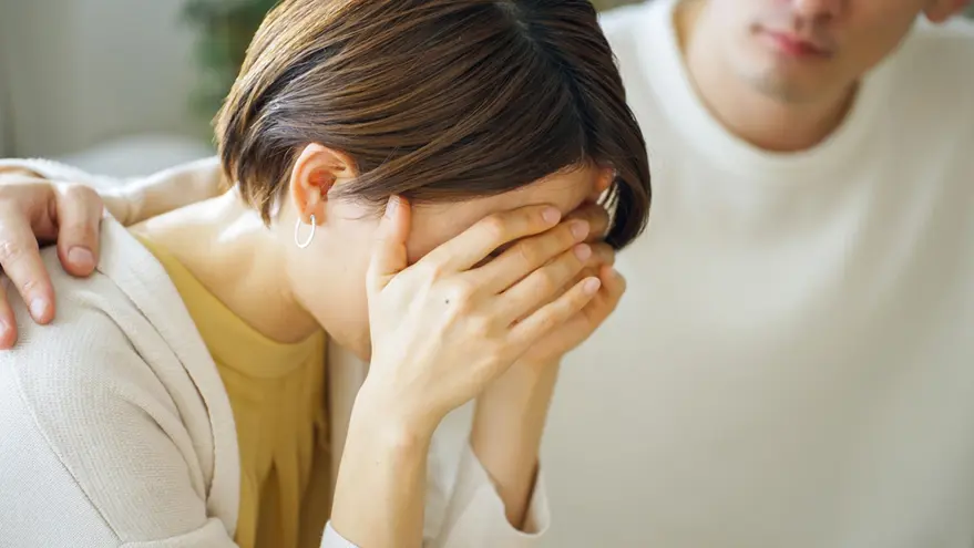 Woman receiving emotional support after pregnancy loss during miscarriage management treatment